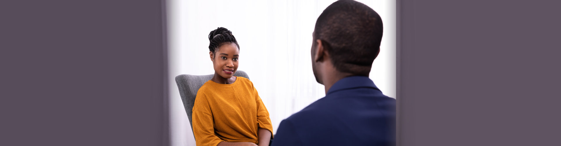 woman sitting near psychologist